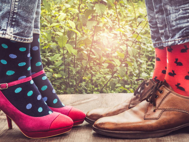 istock Men's and women's legs, bright socks. Close-up 1152048021