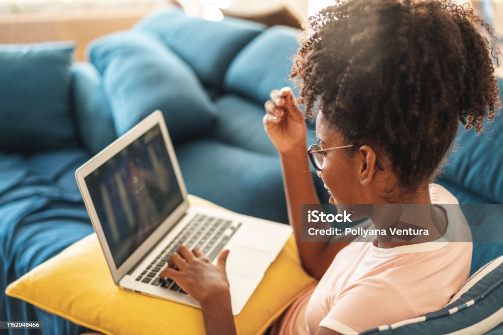 Surfing the Internet Teenager, Laptop, Sofa, Using Laptop, Internet Internet Stock Photo