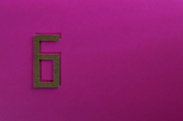istock gold number six on pink background 1152049519