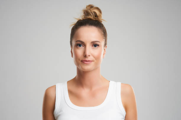 istock Beautiful woman face close up studio on grey 1152050302