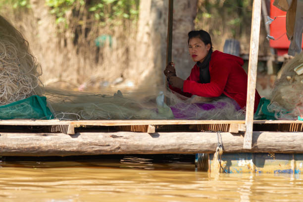 a fishing family of the floating village Chong Kneas on the Lake tonle sap near the town of siem riep  in the east of Cambodia.  Cambodia, Sihanoukville, February, 2001,