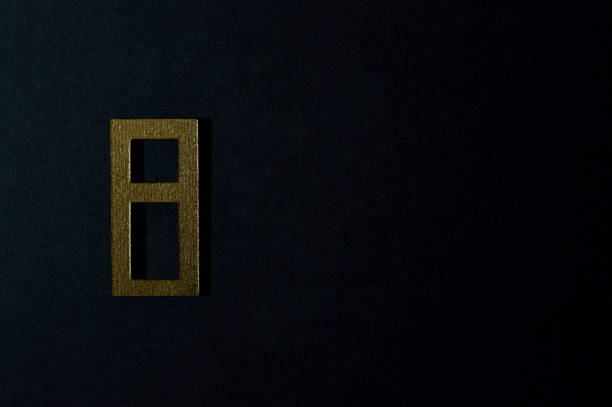 istock gold number eight on dark background 1152052270