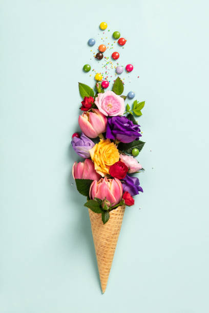 istock Ice cream cone with flowers and sprinkles Summer minimal concept. 1152054438