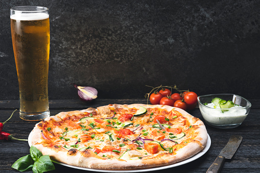 Appetizing pizza with beer.