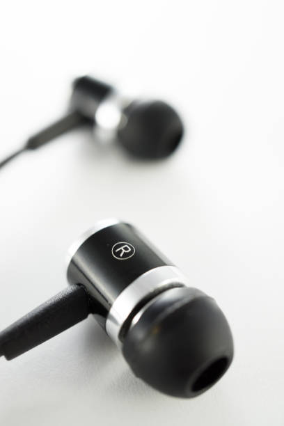 istock Classic black ear bud headphones 1152058923