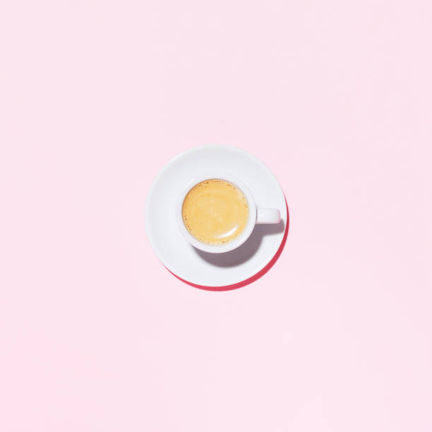 istock A cup of coffee on pink background. 1152062596