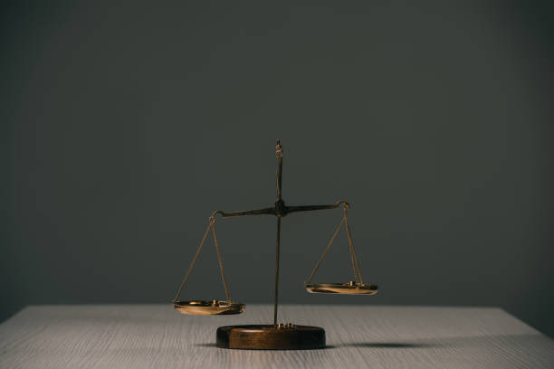 istock empty scales of justice on wooden table on grey 1152062812