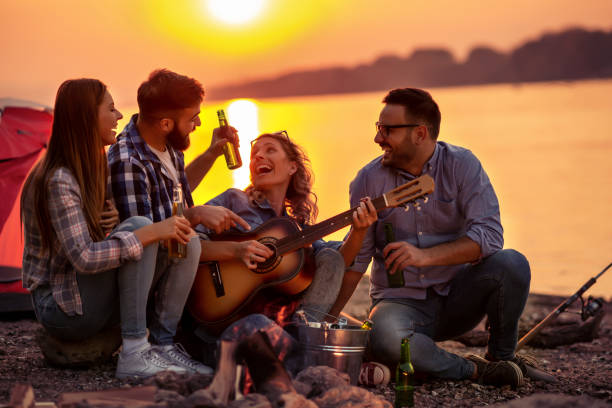 istock Group of young friends having picnic at night 1152064026