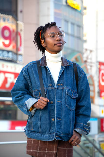 istock Young Woman Looking up in Tokyo 1152064724
