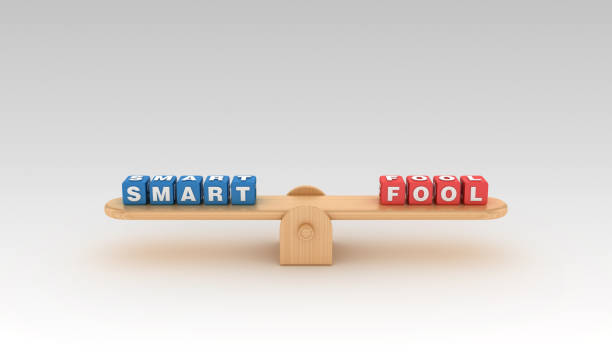 istock Seesaw with SMART FOOL Buzzword Cubes - 3D Rendering 1152066419