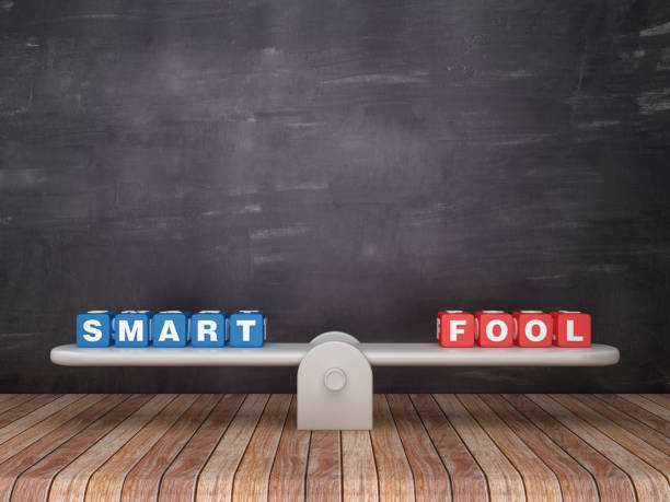 istock Seesaw Scale with SMART FOOL Cubes on Chalkboard Background - 3D Rendering 1152066442