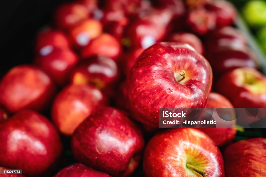Delicious red apples on retail display at supermarket Delicious red apples on retail display at supermarket - No people Apple - Fruit Stock Photo