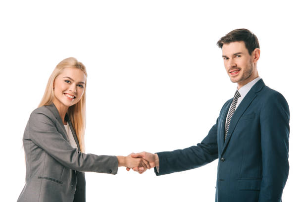 istock smiling successful businesspeople shaking hands isolated on white 1152068060