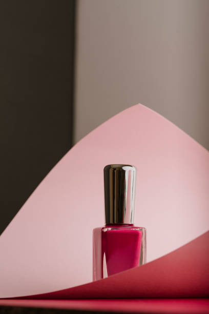istock Pink nail polish on pastel color background 1152070353