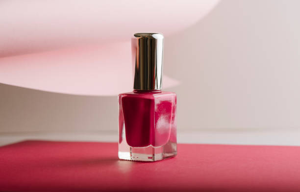istock Pink nail polish on pastel color background 1152071390