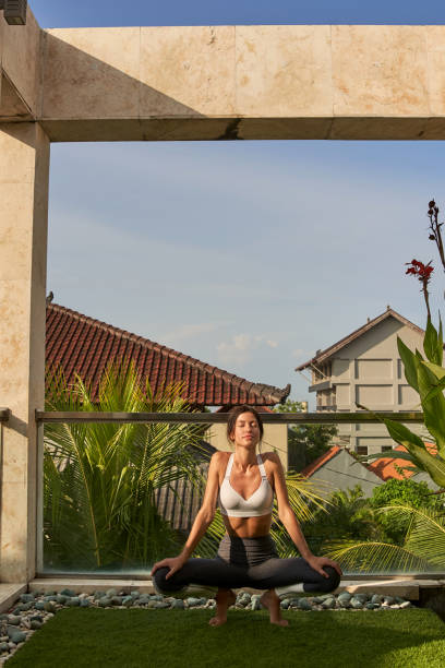 istock Calm woman is exercising on sunny terrace 1152072739