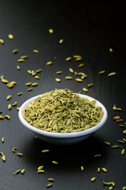 fennel seeds or saunf in a bowl on a wooden table , - ingredient fennel food dry imagens e fotografias de stock