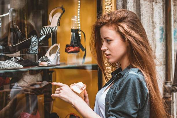 istock Woman with Ice Cream in Shopping 1152075865