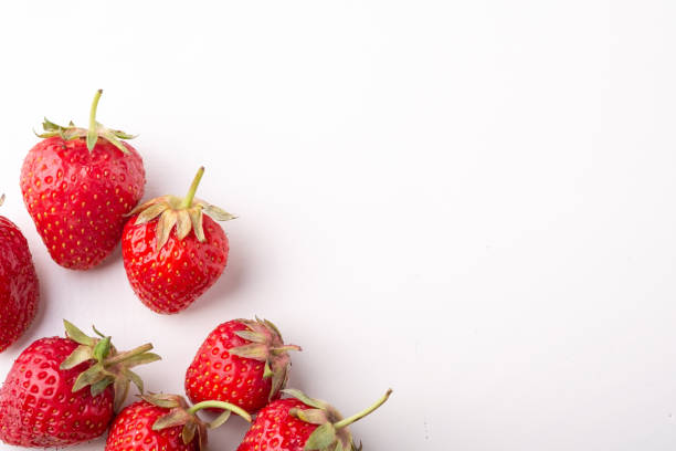 istock Strawberries isolated on white background top view 1152078067