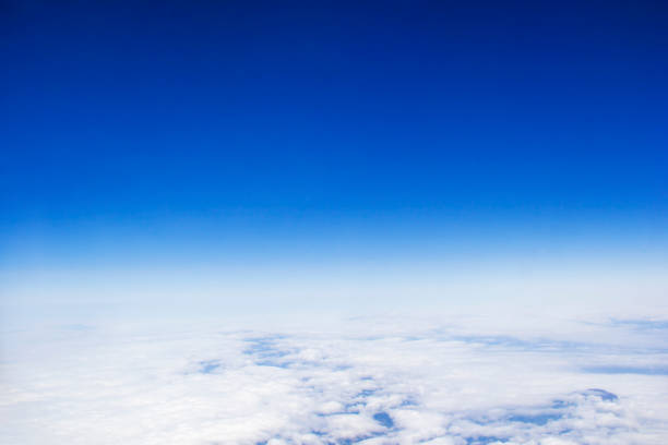 istock Blue sky background and white clouds soft focus, top view and copy space 1152078231