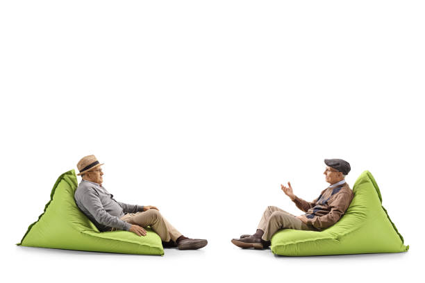 istock Two senior men sitting on bean bags and having a conversation 1152079387