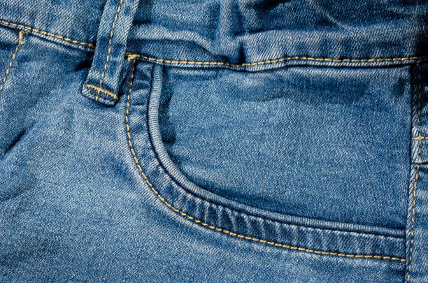 istock Light blue jeans front pocket detail background 1152083279