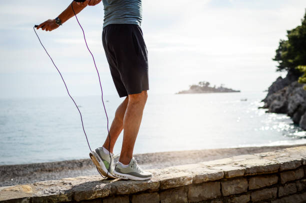 istock Fit man jumping rope at the beach 1152085204