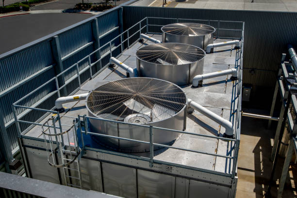 Industrial HVAC Installation Industrial HVAC facility with chillers, pumps and associated plumbing. cooling tower photos stock pictures, royalty-free photos & images