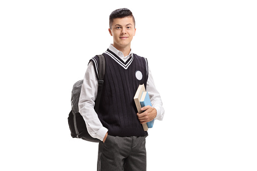 Male student with a backpack and books isolated on white background