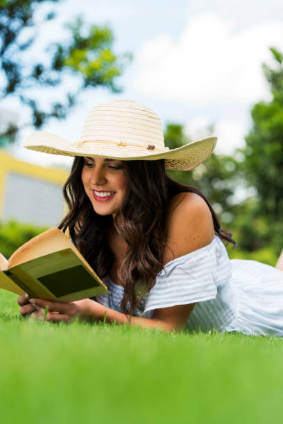 istock Woman in the park reading 1152086920