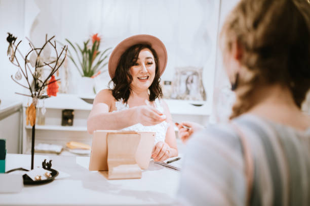 istock Latina Boutique Store Owner At Checkout Counter 1152089994