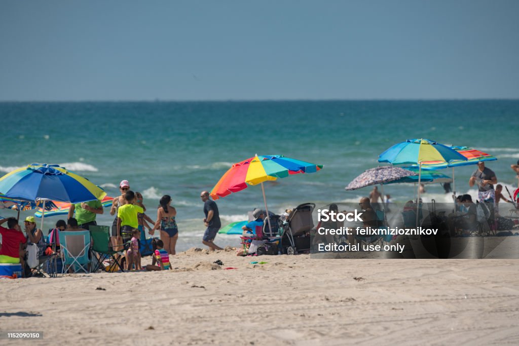 People on the beach during Memorial Day Weekend Hollywood, FL, USA - May 27, 2019: People on the beach during Memorial Day Weekend Beach Stock Photo