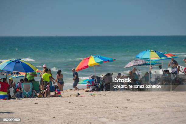 People On The Beach During Memorial Day Weekend Stock Photo - Download Image Now - Beach, Beach Holiday, Blurred Motion