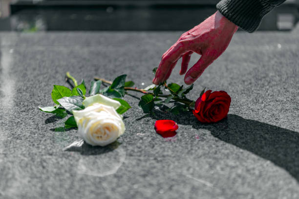 istock Flower on memorial stone close up 1152090749