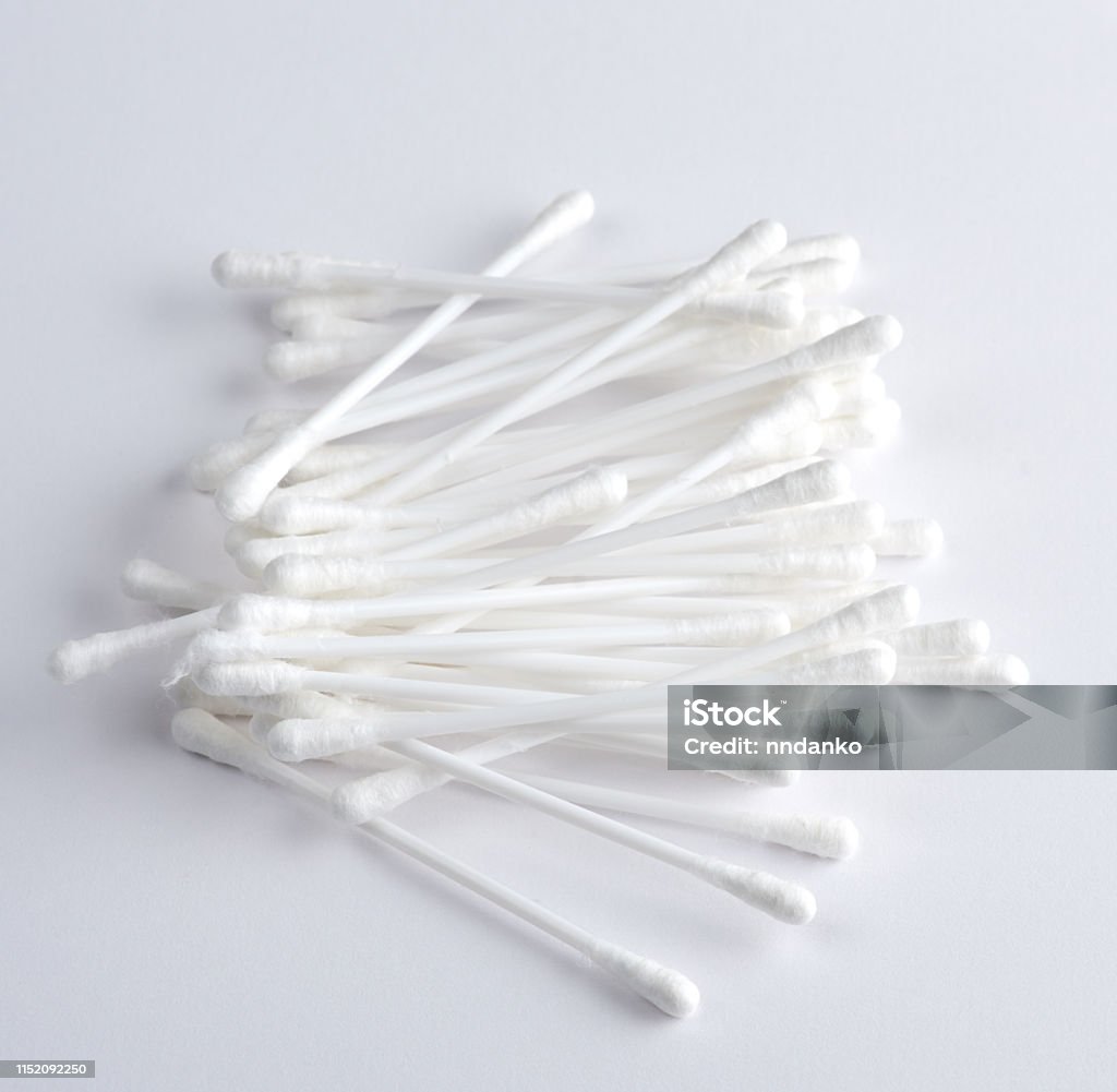 Plastic Sticks With White Cotton For Ear Cleaning And Other Hygiene  Procedures Stock Photo - Download Image Now - iStock
