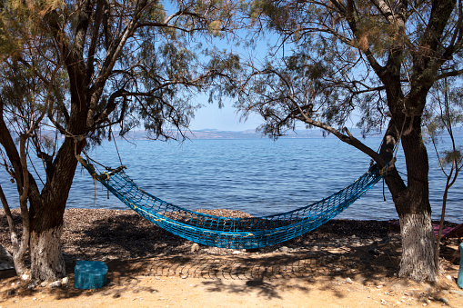 Relaxing in a Hammock on The Aegean Sea Coast with a beautiful view in Lesbos Island Greece