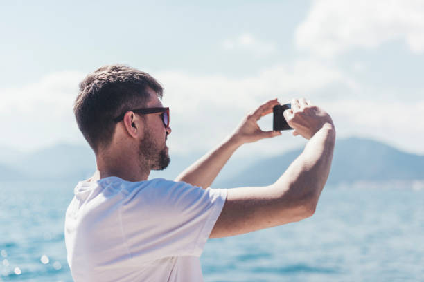 istock Man taking photo by phone 1152093004