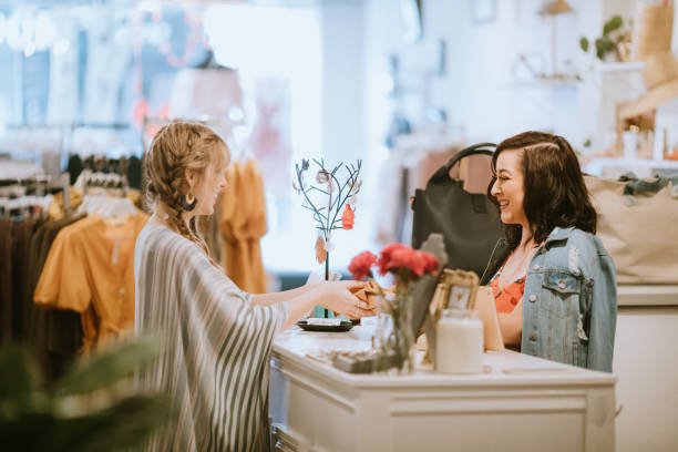 istock Latina Boutique Store Owner At Checkout Counter 1152095157