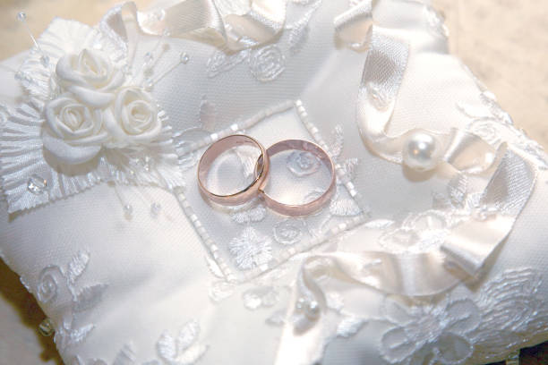 istock gold wedding rings lie on a decorative pillow 1152096104