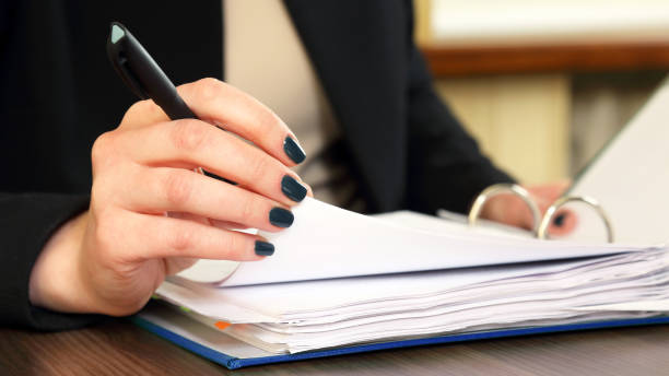 istock hand of business woman with document viewer 1152097768