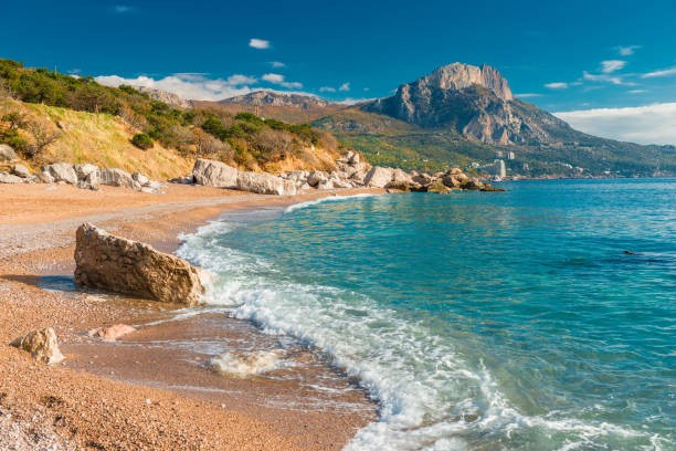 istock a sea wave on a sandy beach, a seascape in the autumn afternoon 1152101059