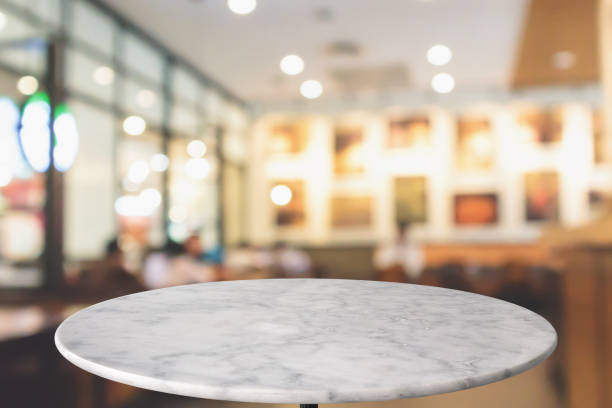 istock round marble table top with cafe restaurant bokeh lights abstract background for montage product display 1152101263