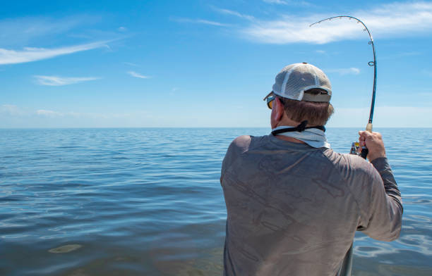 istock Fighting a Fish on Gulf of Mexico 1152104157
