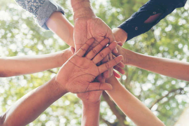 istock Unify communications collaboration.Mission vision business team building identity corporate teamwork industry and workforce.  Mission and strategy for business people holding hands together unified 1152104951