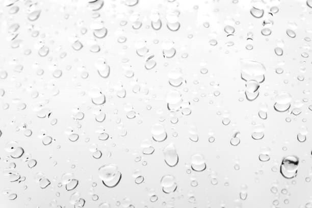 istock Water drops on glass white gray background. 1152107673