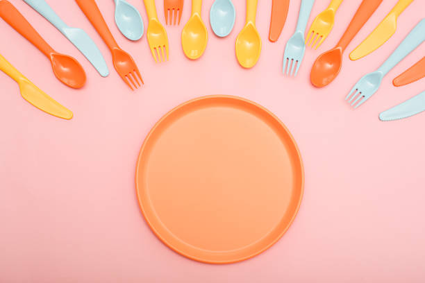 istock Colorful dining set on pink background 1152109154