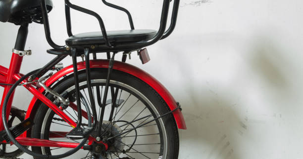 istock red bike beside the white wall 1152109993