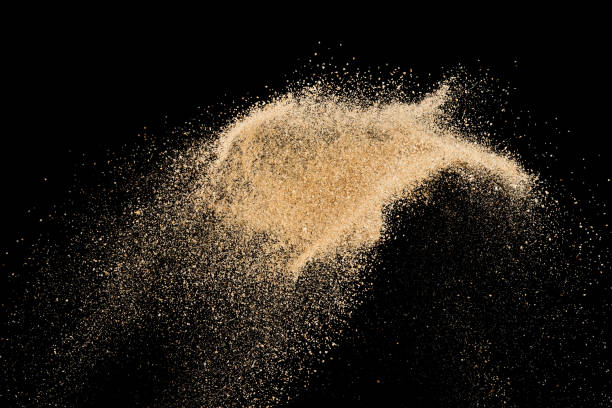 istock Sand splash explosion on dark black background ,throwing freeze stop motion object design 1152110878