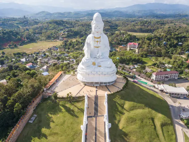 Photo of Aerial view of Big Buddha (Guan Yin Buddha) in Wat Huay Pla Kung temple. Tourist attraction landmark in Chiang Rai province of Thailand.