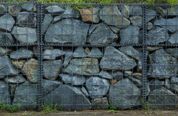 istock landscape stone wall in metal net 1152111773